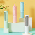 Reusable pet hair brushes shown in four colors; this listing includes one blue brush only